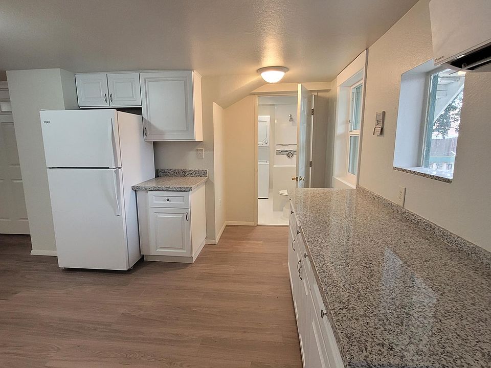 Kitchen again from back door, side bathroom/laundry