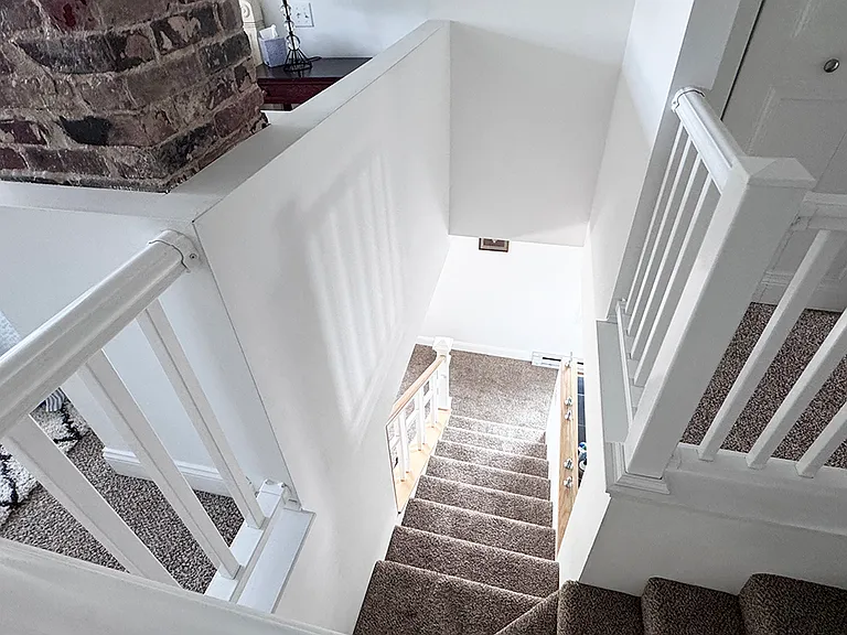 stairs from upper to lower floor.