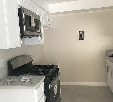 New kitchen cabinets, stove, and microwave