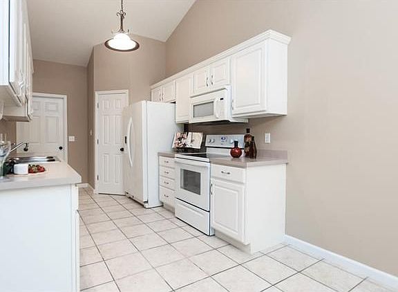 New oven/range, cabinet hardware, light fixtures and newer refrigerator