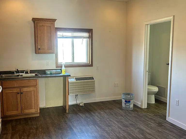 Kitchen open concept with new flooring, very spacious .