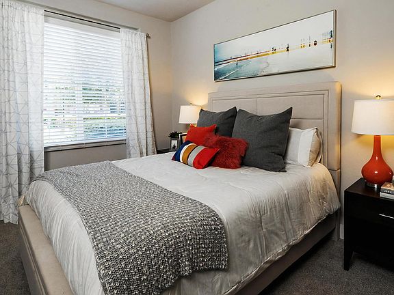 One-Bedroom Interior Featuring Neutral Tones and Modern Lamps