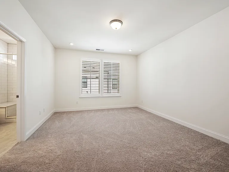 large main bedroom with walk in closet and attached bath