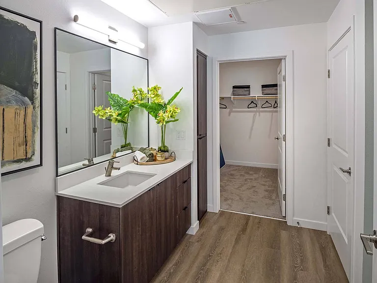 Enjoy the freedom of space in a roomy bathroom, designed for both comfort and convenience.