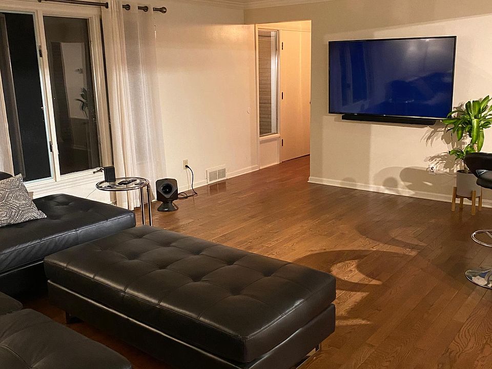 Family room with flat screen smart TV and surround sound.