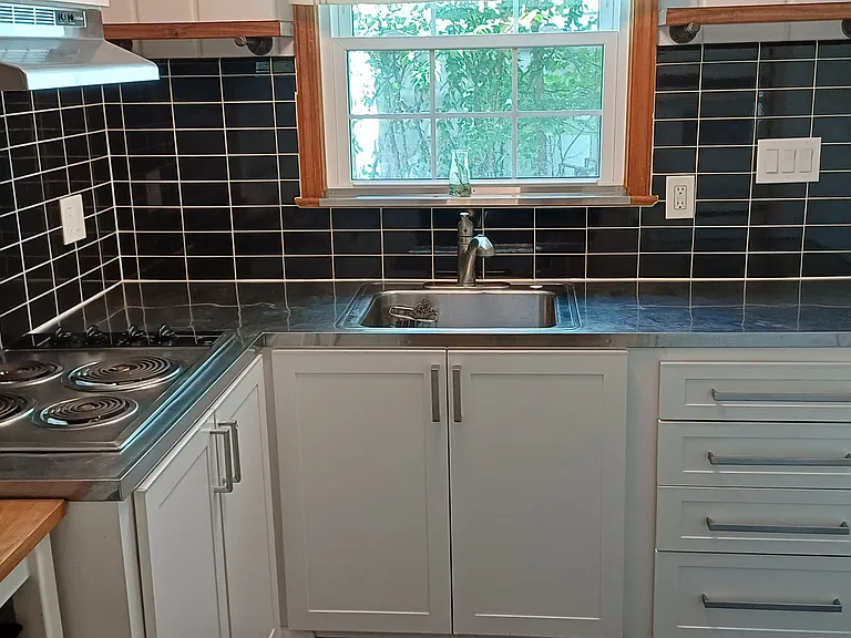 Stainless steel counter tops blend new and classic kitchen features.