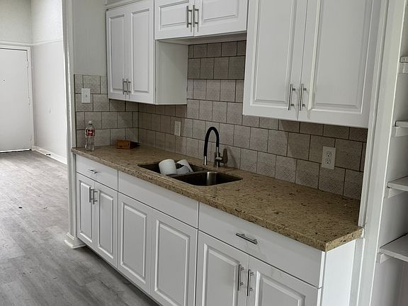 New Granite Countertops and Cabinets and Backsplash