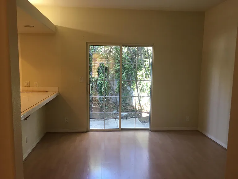Dining Room with an eat-in counter; slider to small backyard