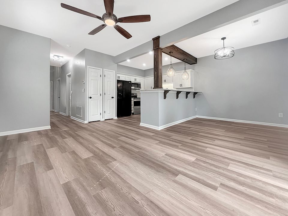 Full view of downstair great room: Kitchen, living room, dining