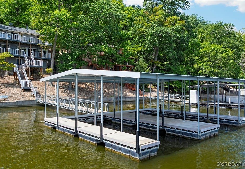 Lakefront home with 2 well covered concrete dock a