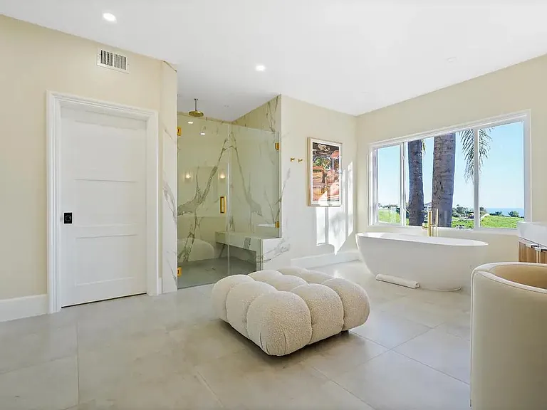 Indulge in the opulence of the master bathroom.