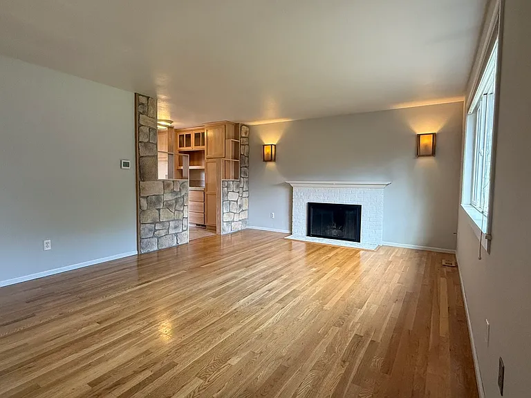 Bright living room with fireplace.