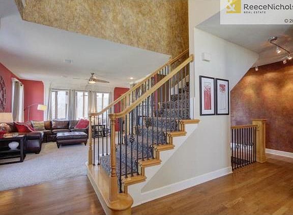 Designer carpet and wrought iron spindles.