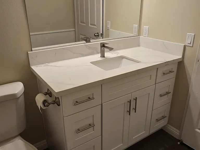 1st floor powder bathroom has been completely updated with new vanity, quartz countertop, new sink, new faucet, and new exhaust fan