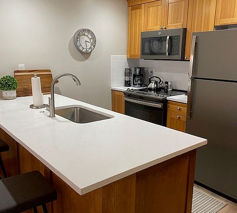 New quartz countertops, appliances,
stainless sink and faucet.