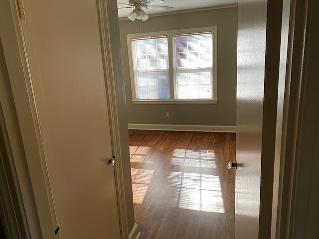 Bedroom #2 with Hardwood Floors, Ceiling Fan and A/C Window Unit.