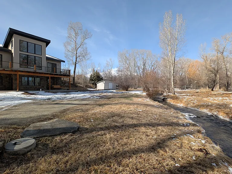 Spacious yard, private driveway, seasonal irrigation ditch, and storage shed for tenant use