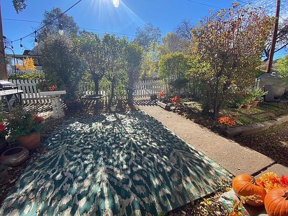 Front yard and white picket fence.