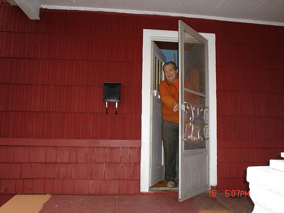 Charles at the front door of 2449 Poplar