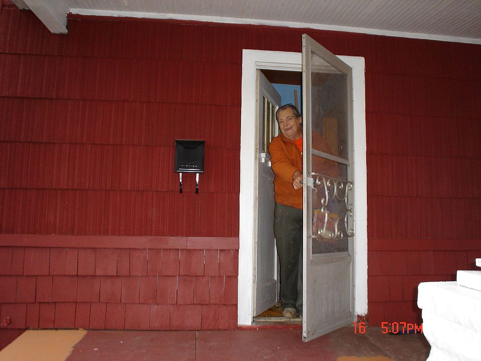 Charles at the front door of 2449 Poplar