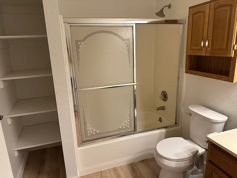 First floor shower and storage. All new flooring.