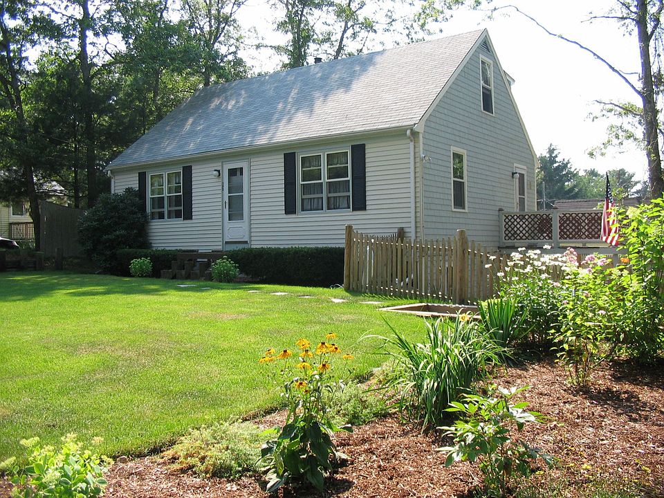 Turn-key Cape with nice landscaping and a fenced yard.