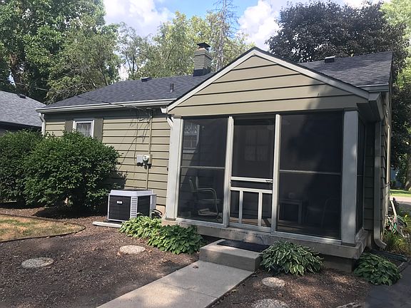 Back yard and screened porch with ceiling fan and light