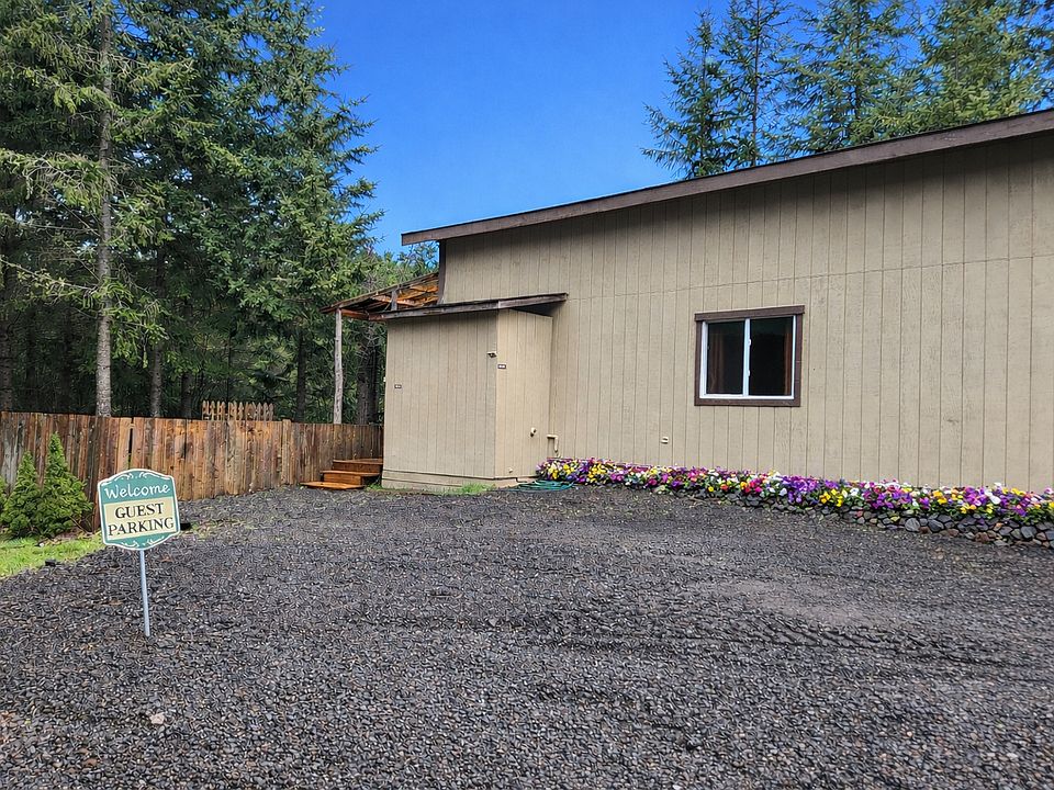 The apartment is behind our shop. You do have two designated parking spots and the entry to the apartment is up those stairs by the fence.