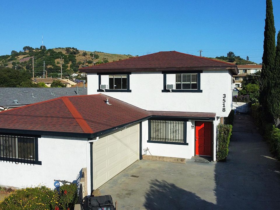 Front with attached two car garage