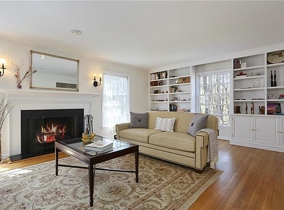 Spacious living room with built-ins and fireplace.