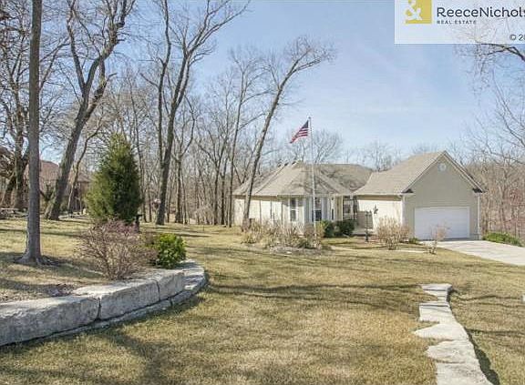 Wonderful landscaping and path to house.