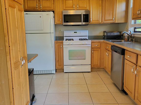 Kitchen. Has 2 access points. One from top of stairs on main entrance and from the dining area.