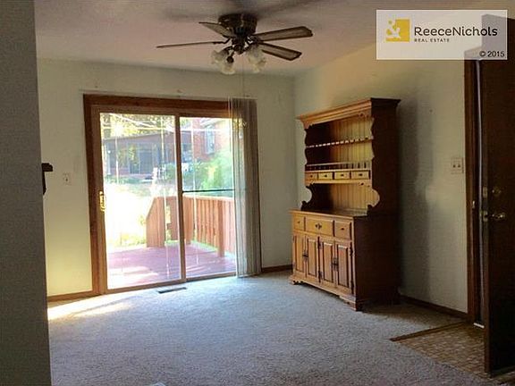 Sliding glass doors out to deck & small fenced yard.