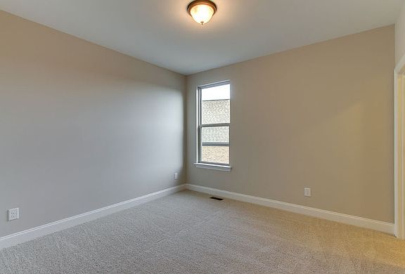 The Woodbury Bedroom 2 with beige carpet