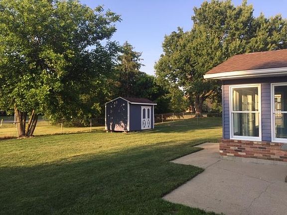 Fenced yard with shed to store lawn tools