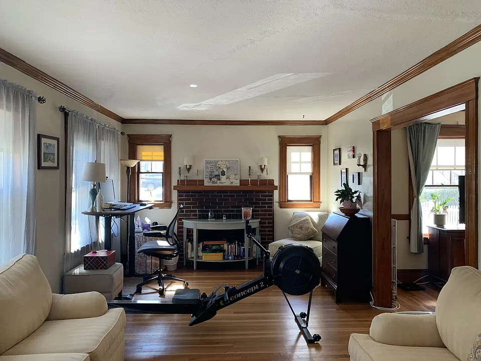Large living room with decorative fireplace