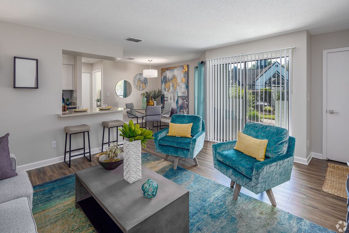 Spacious living room with hardwood-style flooring