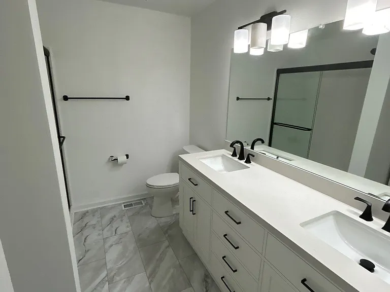 Nathan's team did an amazing job on the bathroom--but he still needs to add that missing light bulb! :-)