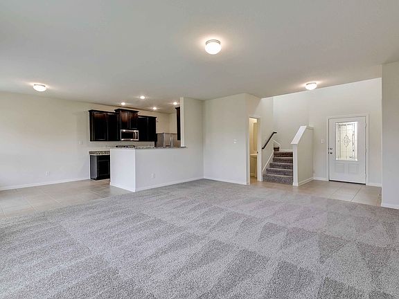 The living area is open to the kitchen and dining room.