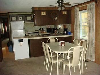 There is a full wall storage in this dining room.