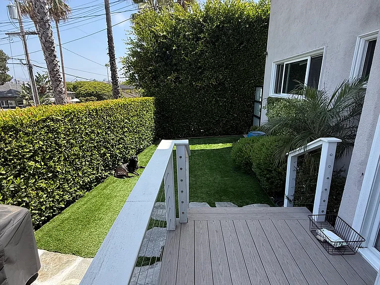 Deck to yard. Deck accommodates bistro table and chairs