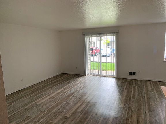 Huge living room that opens to a patio with storage