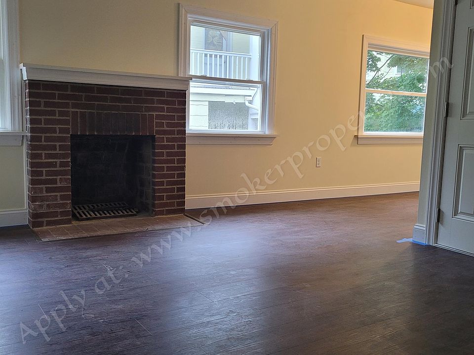 Living room with decorative fire place