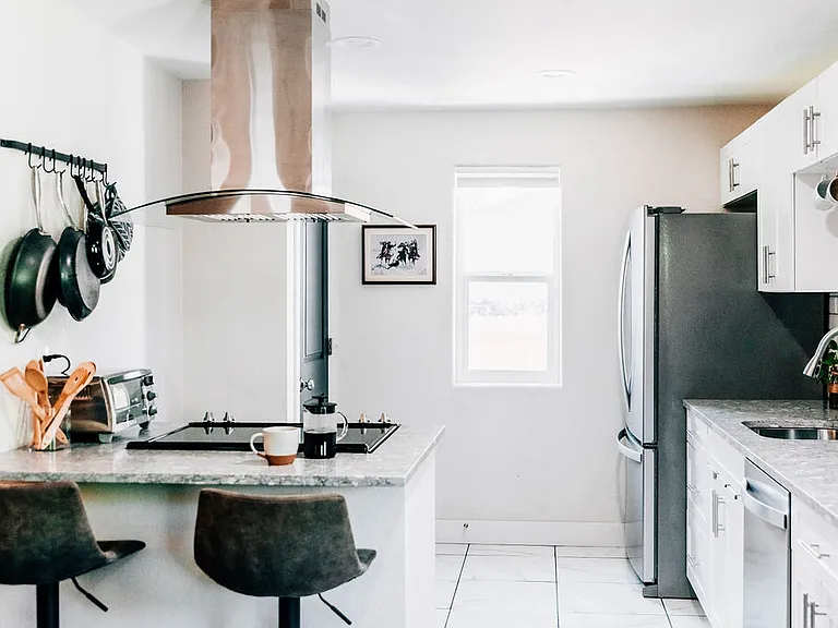 Kitchen - fully stocked. Breakfast bar. Open floor plan.