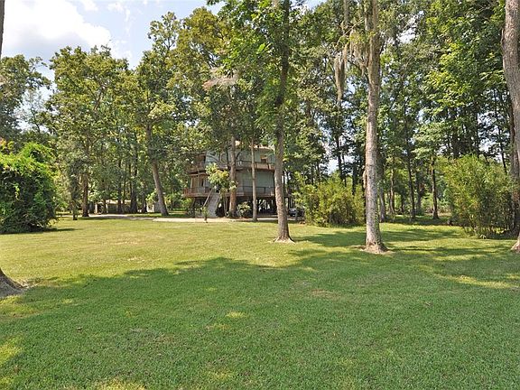 Over and acre of rolling land with gorgeous oak and cypress trees