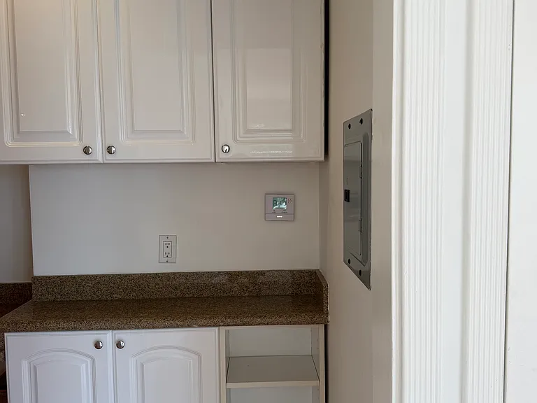 CUSTOM PANTRY PROVIDES ADDITIONAL CABINETS AND STORAGE