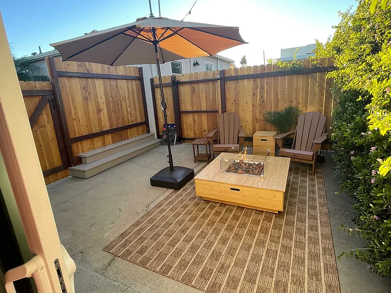 Fire pit table, umbrella, private patio for studio use only. Barbecue use for both house and studio use outside the gate.