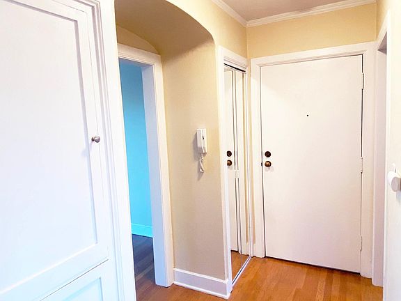 Foyer: Coat Closet, Linen Cabinet, Security Intercom with Door Release