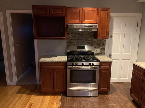 5 burner Gas Range stove, microwave cabinet, ceramic flooring