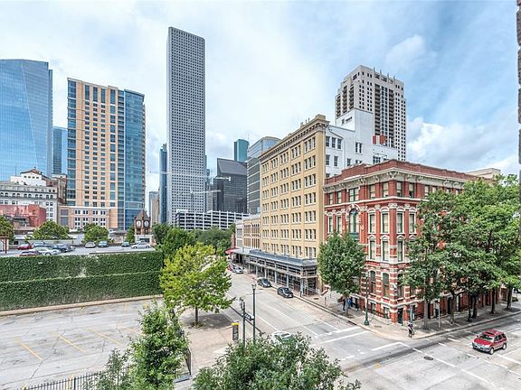 Views from Living Room and Secondary Bedroom of Bayou Lofts #3D! Historic buildings in foreground and modern skyscrapers in background. What a view. Plus from 3rd floor you still get some treetop green views, which is unusual in Downtown!